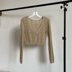 Light gold cropped knitted cardigan. Long sleeve. Urban Outfitters. Size S